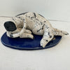 Curled up Spotty Dog on Blue Base