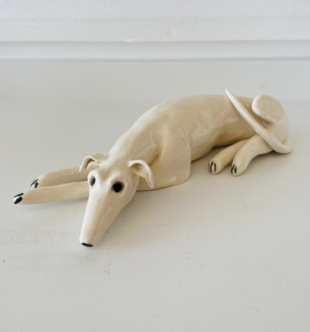 Exhausted Dog on white rug